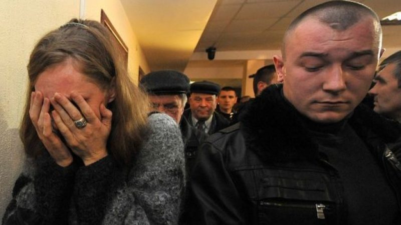 A woman cries after a family member is sentenced to death in a Belarus court. Photo: AFP