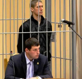 Uladzislau Kavaliou and his lawyer at the trial