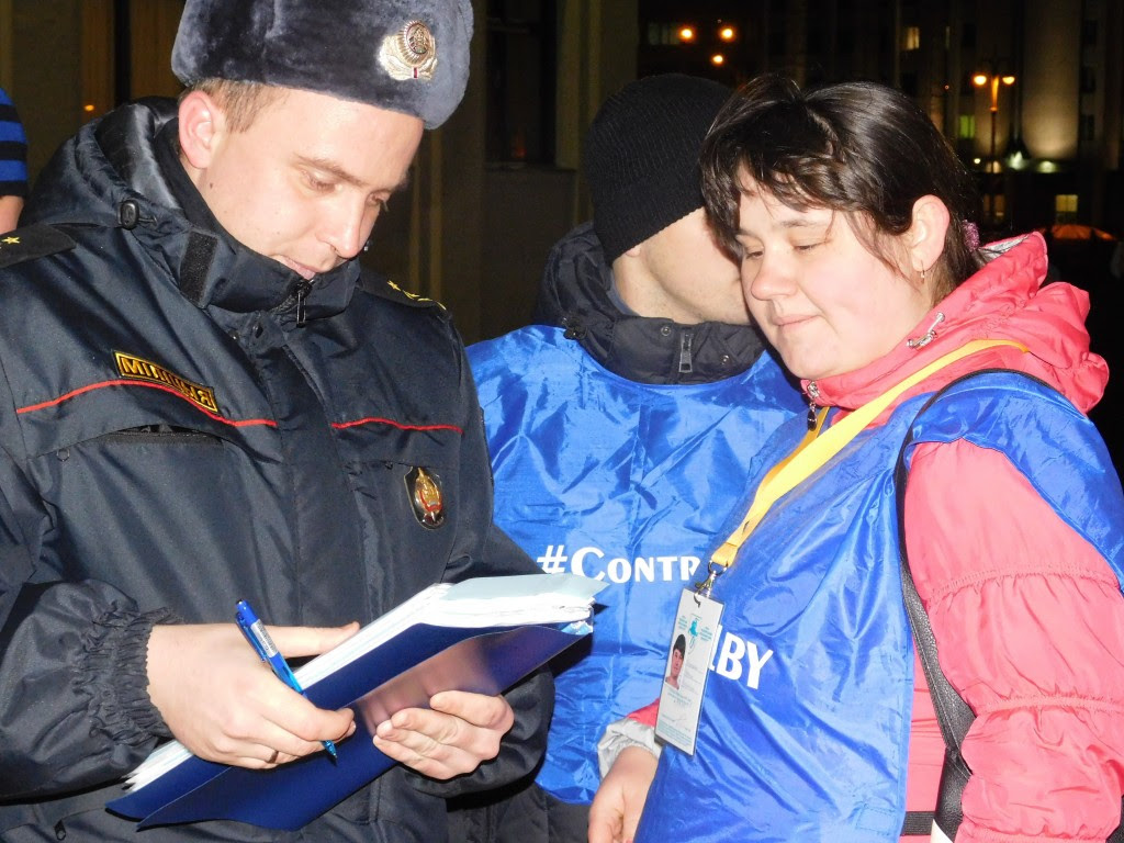 Observers working during a protest to mark the anniversary of the 1996 referendum in Minsk on 24 November 2015