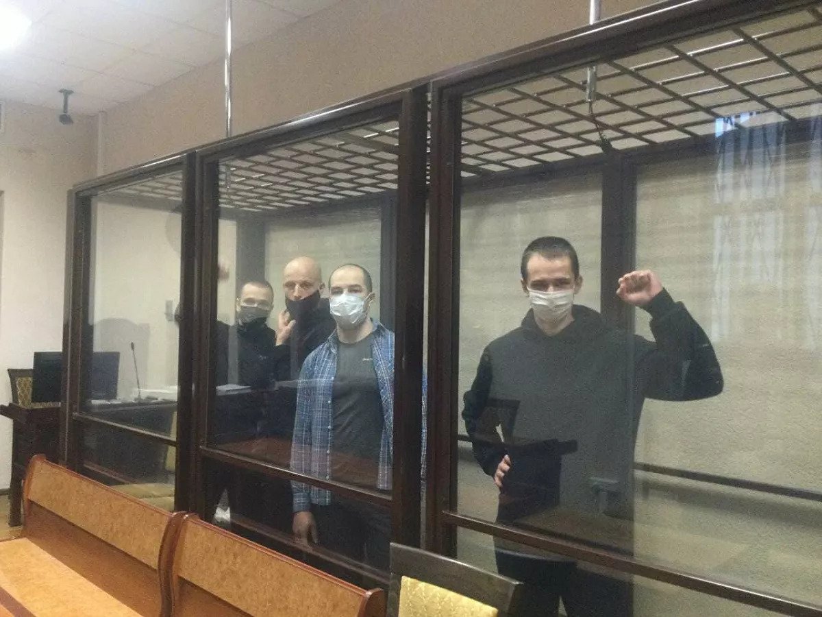 Dzmitry Dubouski, Dzmitry Rezanovich, Ihar Alinevich and Siarhei Ramanau in the courtroom. Photo by Hanna Niafiodava.