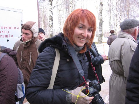 Yuliya Darashkevich taking photos at a street rally