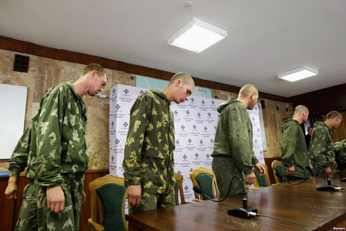Detained Russian paratroopers at a press conference in Kyiv