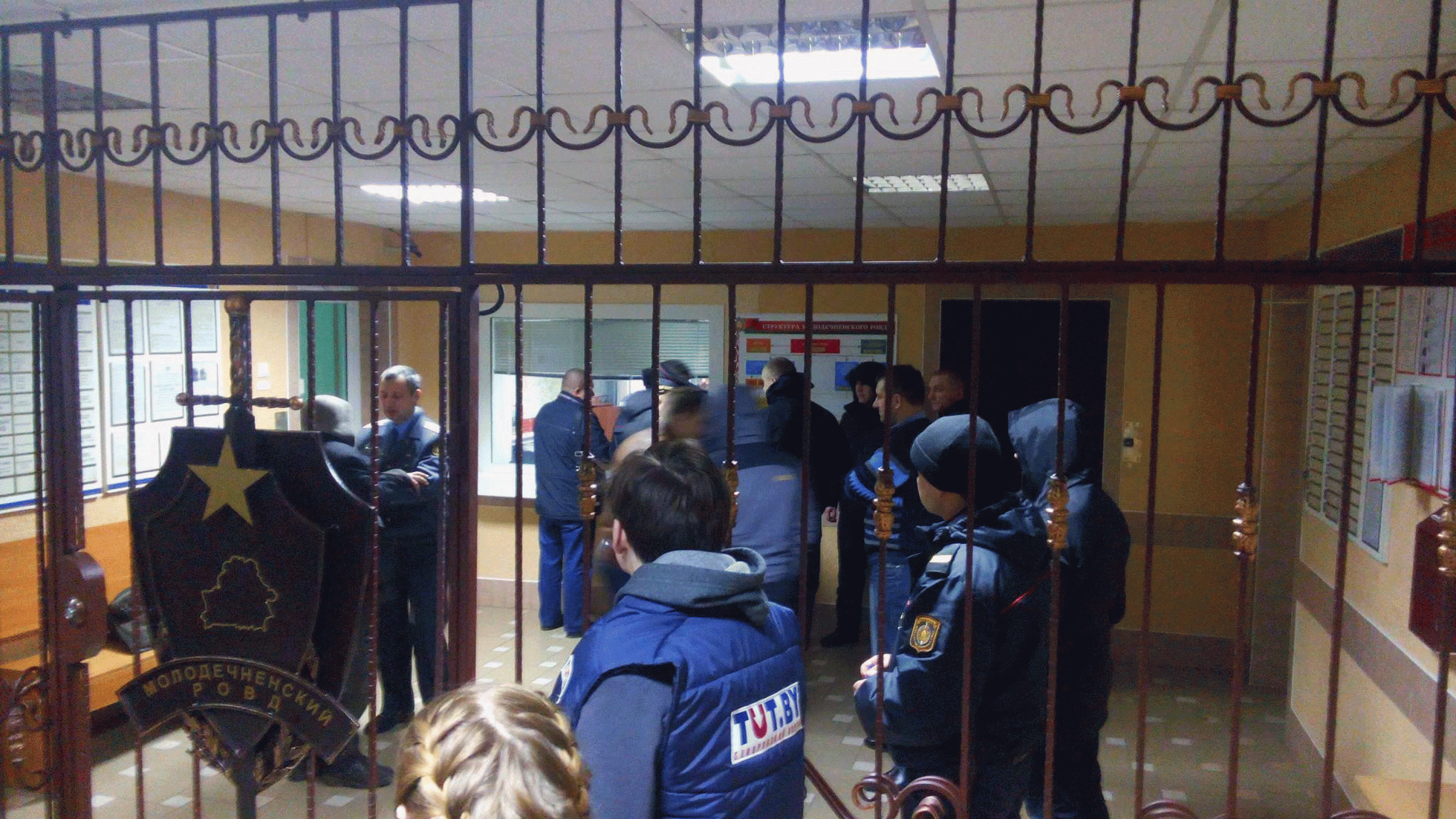 Reporters and observers waiting in the lobby of the Maladziečna city police department after the detention of opposition leaders. March 10, 2017