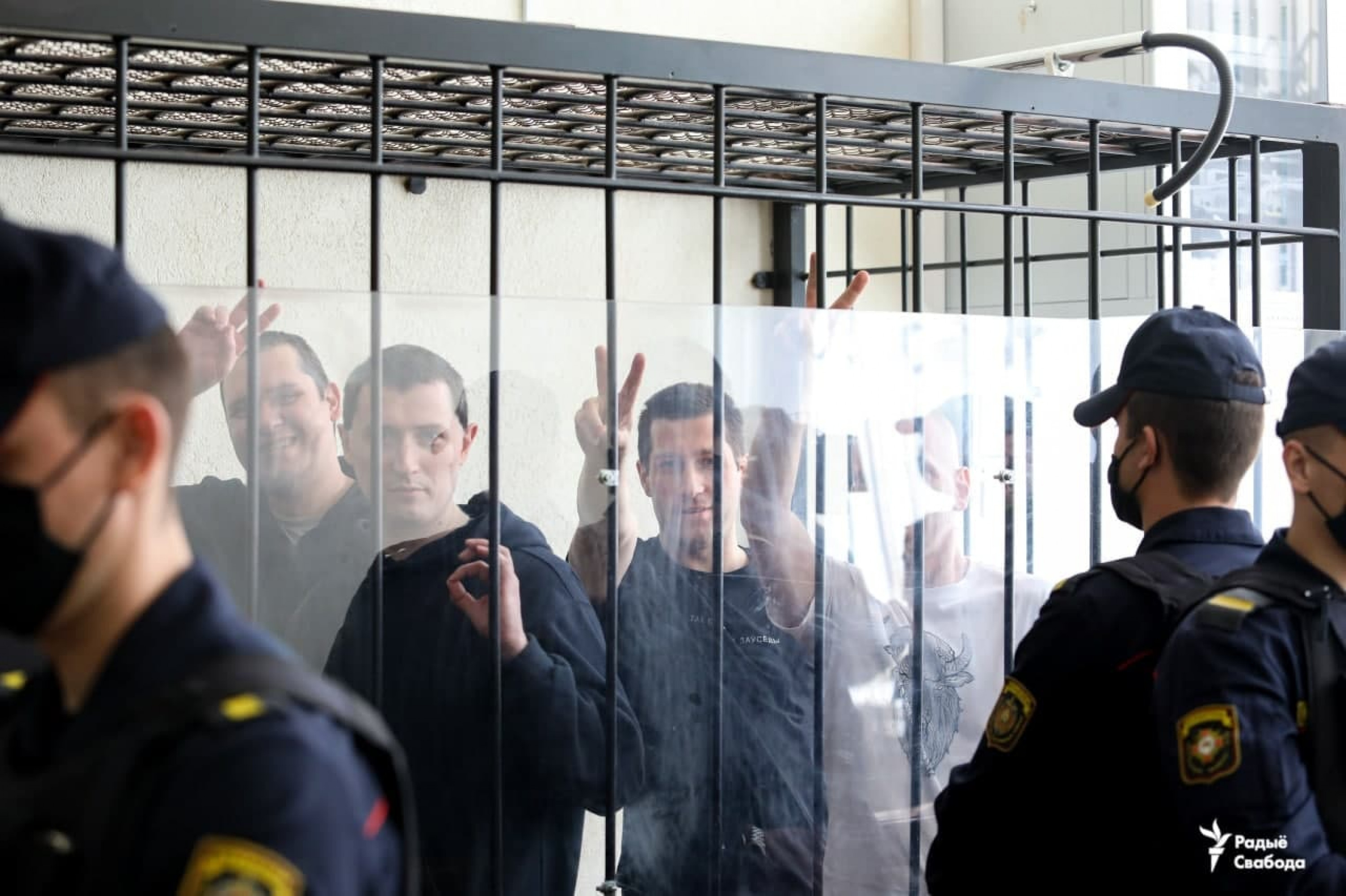Andrei Voinich, Dzmitry Kazlou, Pavel Yukhnevich and Yauhen Afnahel on trial. Photo: svaboda.org